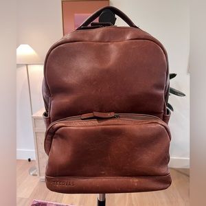 Tecovas brown leather backpack. Several interior pockets and zippered compartmen